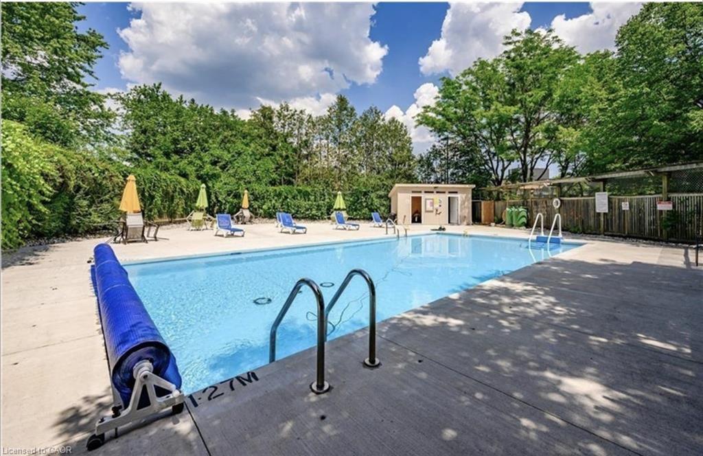 405-89 Westwood Road, Guelph, ON - Outdoor With In Ground Pool With Backyard