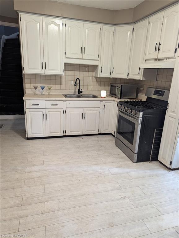 151 Gibson Avenue, Hamilton, ON - Indoor Photo Showing Kitchen With Double Sink