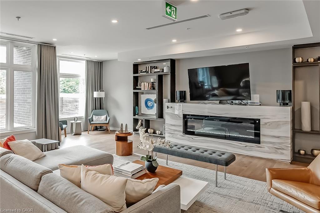 302-457 Plains Road E, Burlington, ON - Indoor Photo Showing Living Room With Fireplace