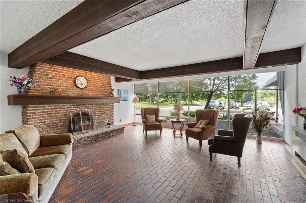 611-225 Harvard Place, Waterloo, ON - Indoor Photo Showing Other Room With Fireplace