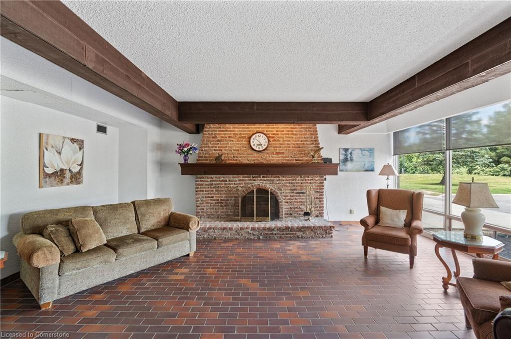 611-225 Harvard Place, Waterloo, ON - Indoor Photo Showing Living Room With Fireplace