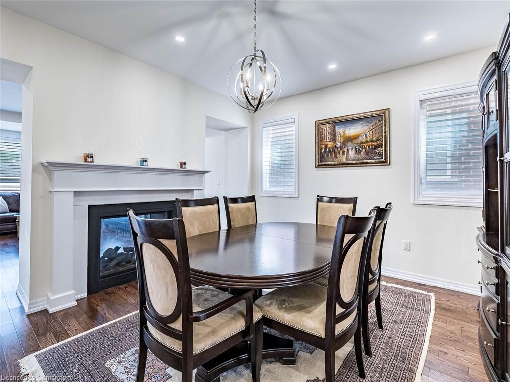 323 Harold Dent Trail, Oakville, ON - Indoor Photo Showing Dining Room With Fireplace