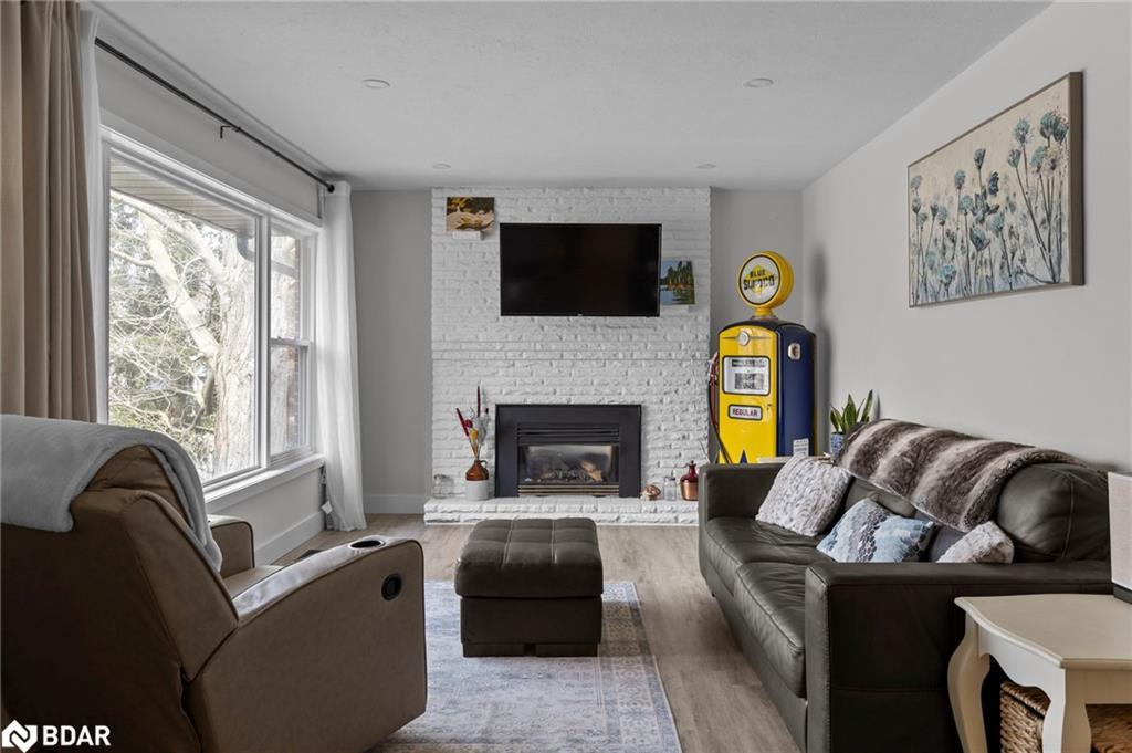 99 Wellington Street E, Barrie, ON - Indoor Photo Showing Living Room With Fireplace