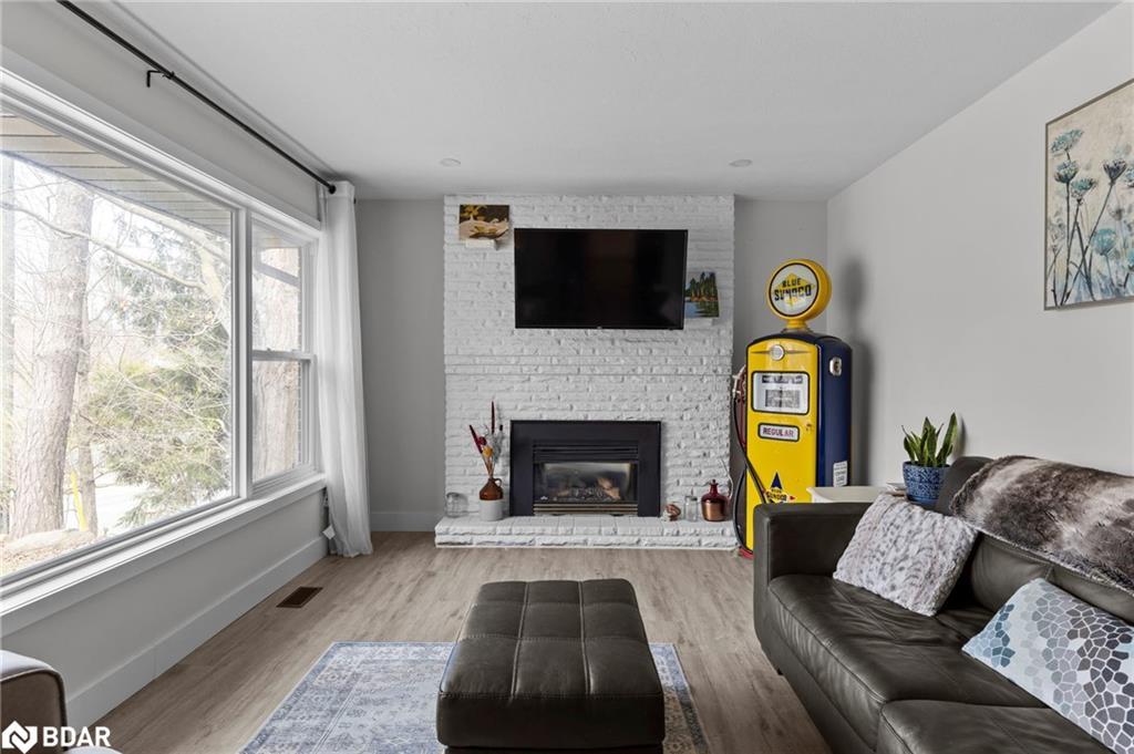 99 Wellington Street E, Barrie, ON - Indoor Photo Showing Living Room With Fireplace
