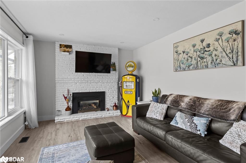 99 Wellington Street E, Barrie, ON - Indoor Photo Showing Living Room With Fireplace