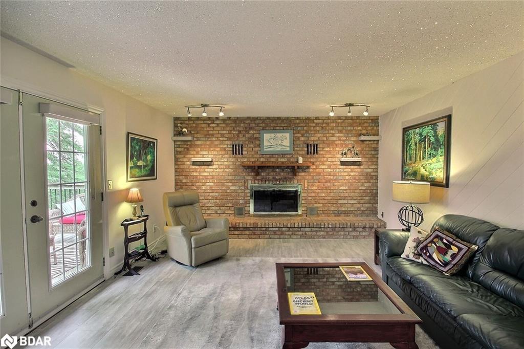 3268 County Road 3 Road, Carrying Place, ON - Indoor Photo Showing Living Room With Fireplace