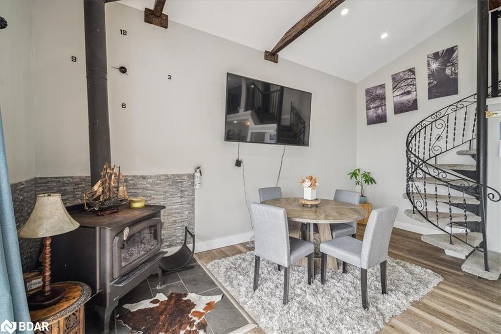 339520 Presqu'Ile Road, Georgian Bluffs, ON - Indoor Photo Showing Dining Room With Fireplace