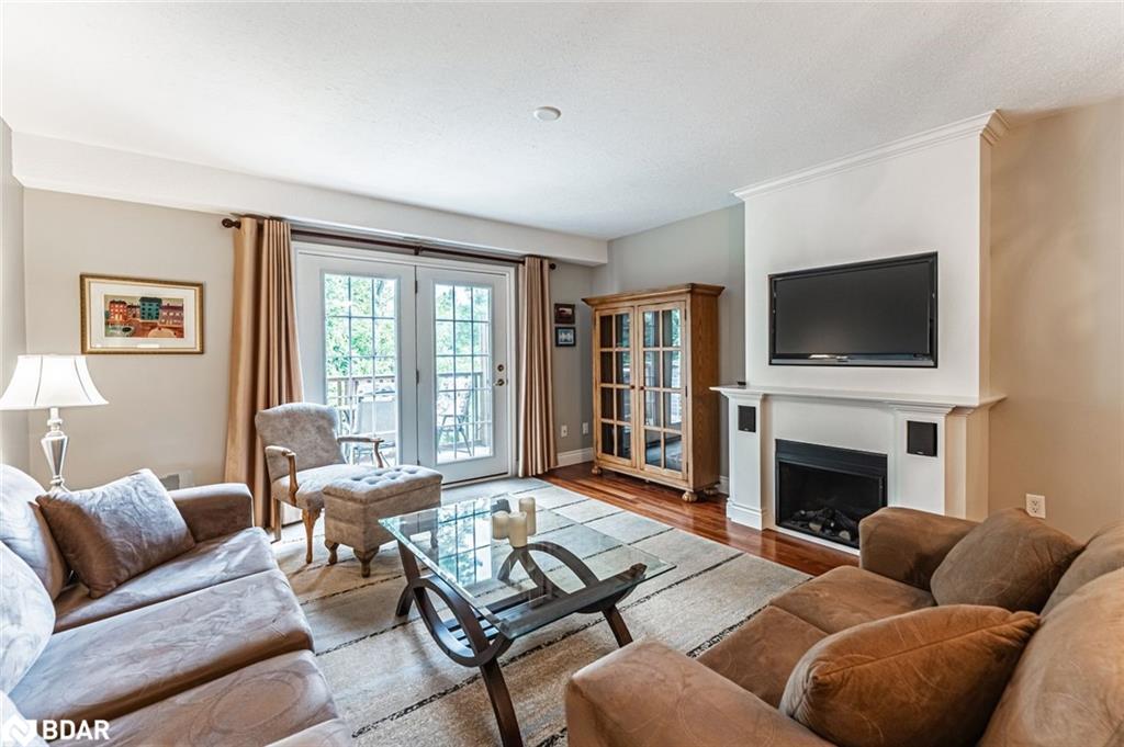 7-222 Steel Street, Barrie, ON - Indoor Photo Showing Living Room With Fireplace