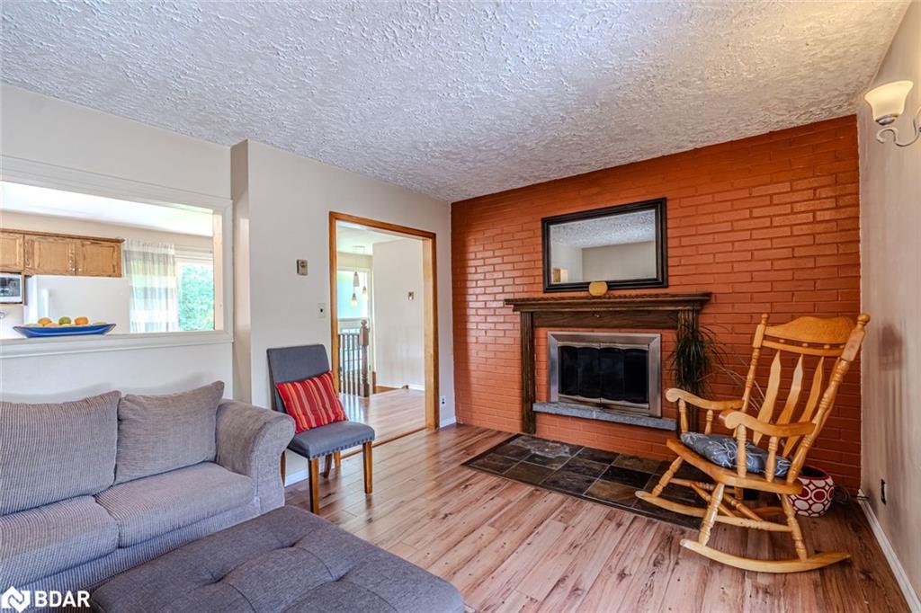 250 Sunnybrae Avenue, Innisfil, ON - Indoor Photo Showing Living Room With Fireplace