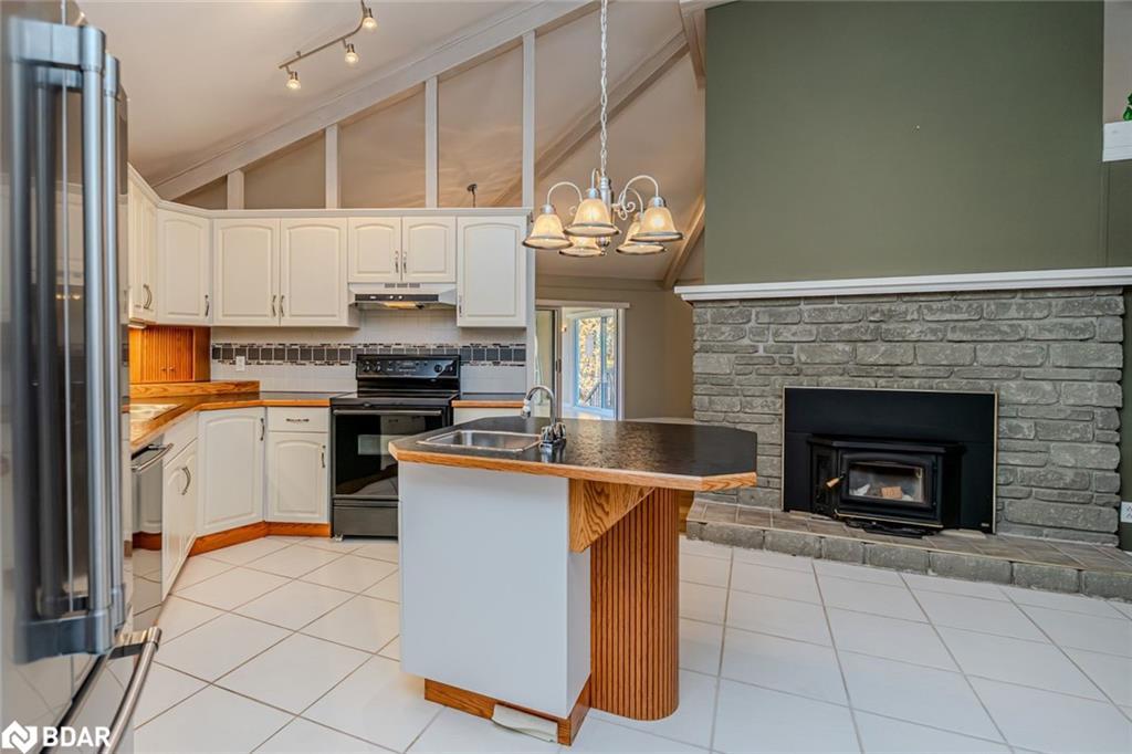 1564 Honey Harbour Road, Georgian Bay, ON - Indoor Photo Showing Kitchen With Fireplace With Double Sink