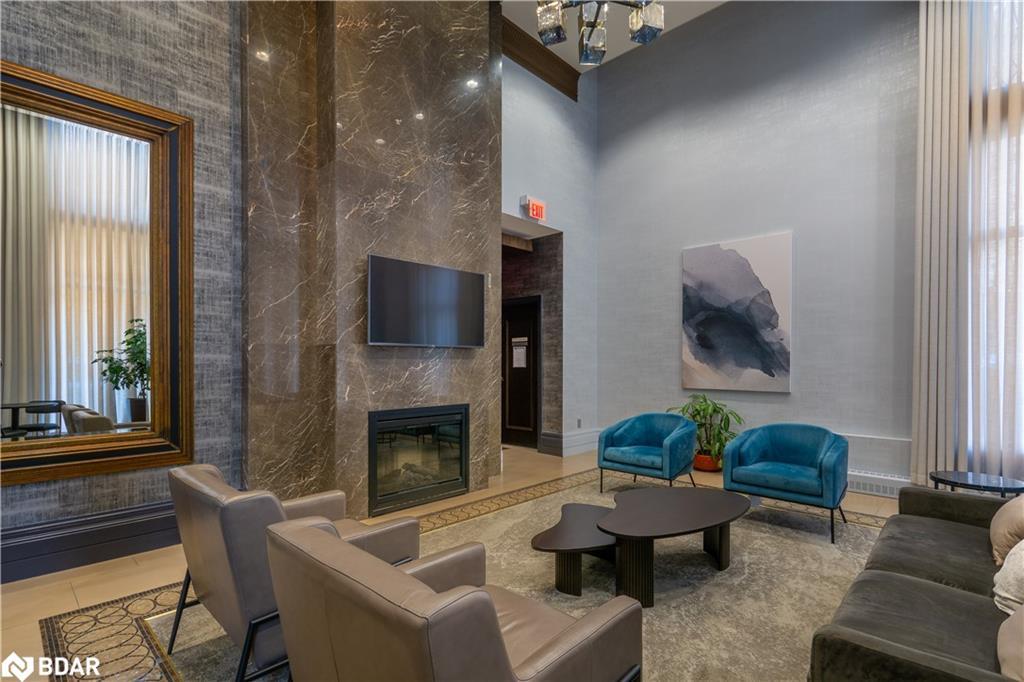 307-385 Prince Of Wales Drive, Mississauga, ON - Indoor Photo Showing Living Room With Fireplace