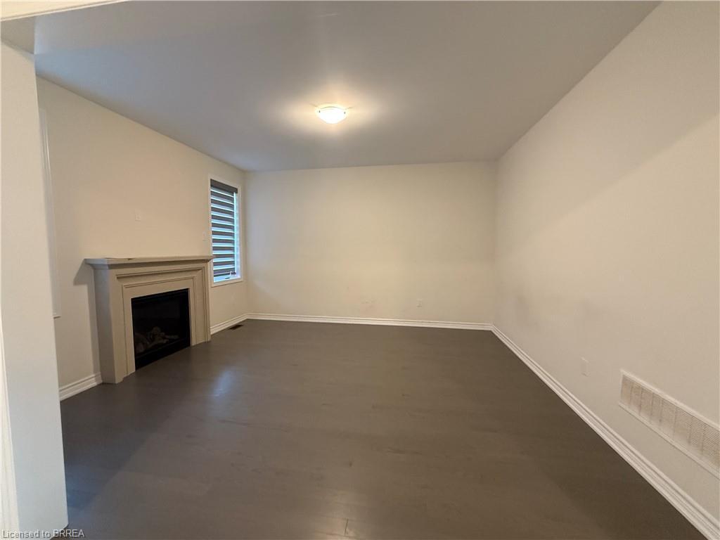 44 Eccleston Street, Brantford, ON - Indoor Photo Showing Other Room With Fireplace