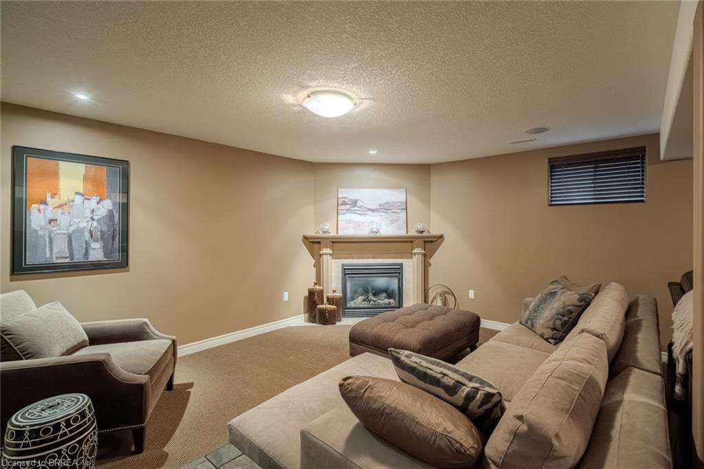 49-655 Park Road N, Brantford, ON - Indoor Photo Showing Basement With Fireplace