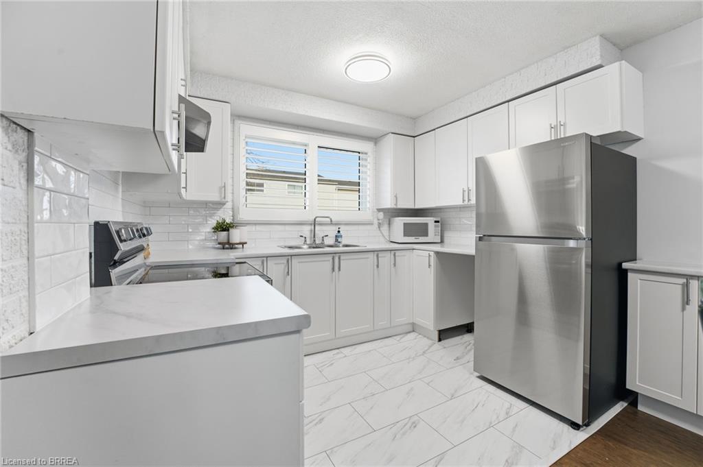 F-281 Stanley Street, Brantford, ON - Indoor Photo Showing Kitchen With Double Sink