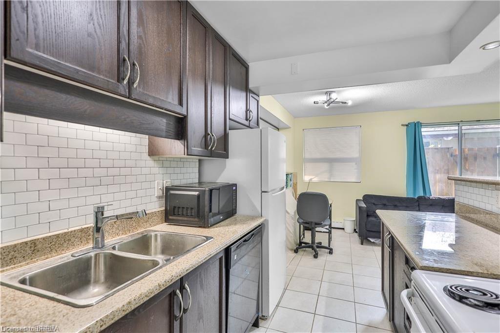104-793 Colborne Street E, Brantford, ON - Indoor Photo Showing Kitchen With Double Sink