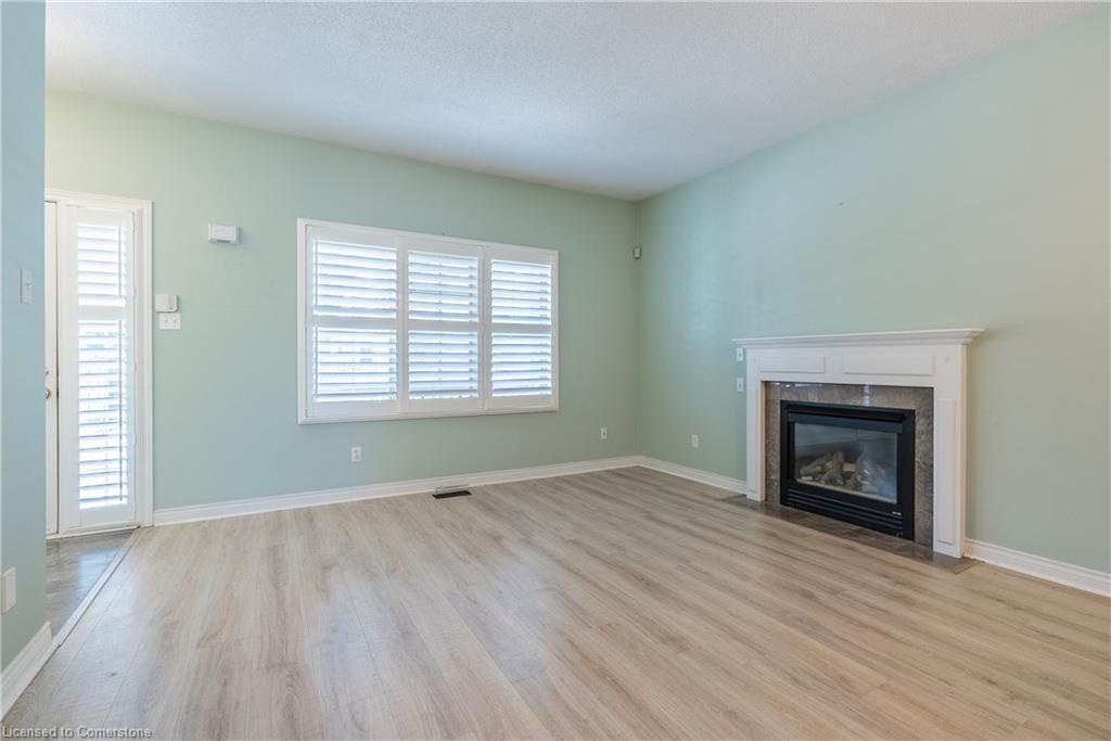 3-34 Southbrook Drive, Binbrook, ON - Indoor Photo Showing Living Room With Fireplace