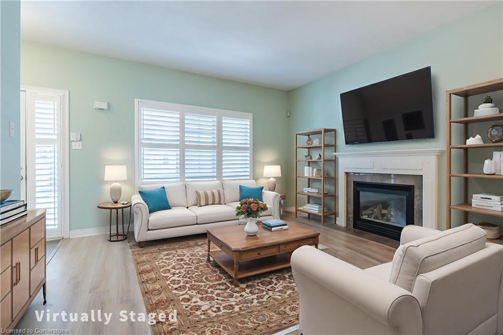 3-34 Southbrook Drive, Binbrook, ON - Indoor Photo Showing Living Room With Fireplace