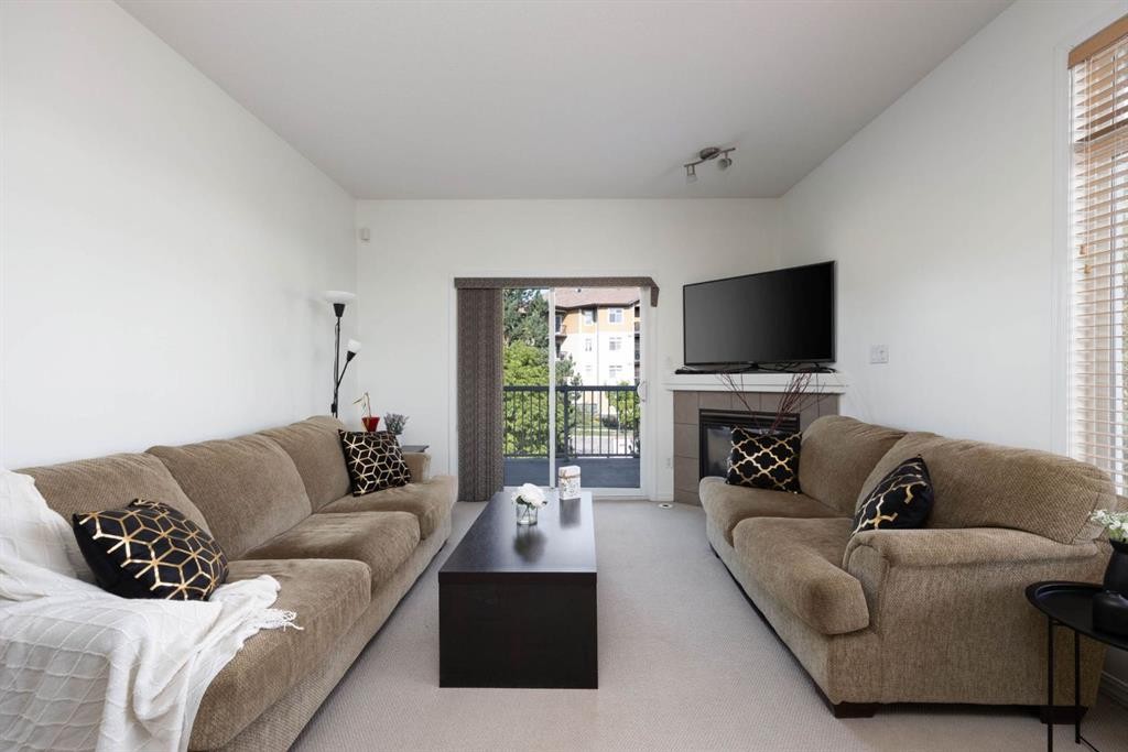 5-105 Fontaine Crescent, Fort Mcmurray, AB - Indoor Photo Showing Living Room With Fireplace