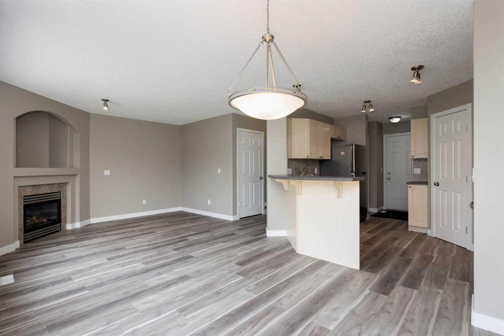 164 Cinnamon Street, Fort Mcmurray, AB - Indoor Photo Showing Kitchen With Fireplace