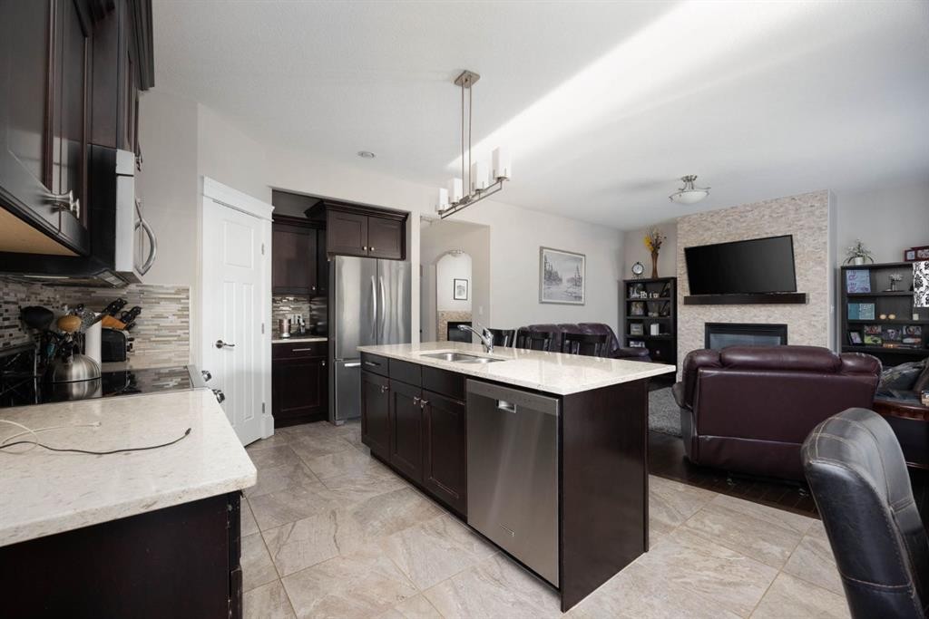 149 Ward Crescent, Fort Mcmurray, AB - Indoor Photo Showing Kitchen With Fireplace With Upgraded Kitchen