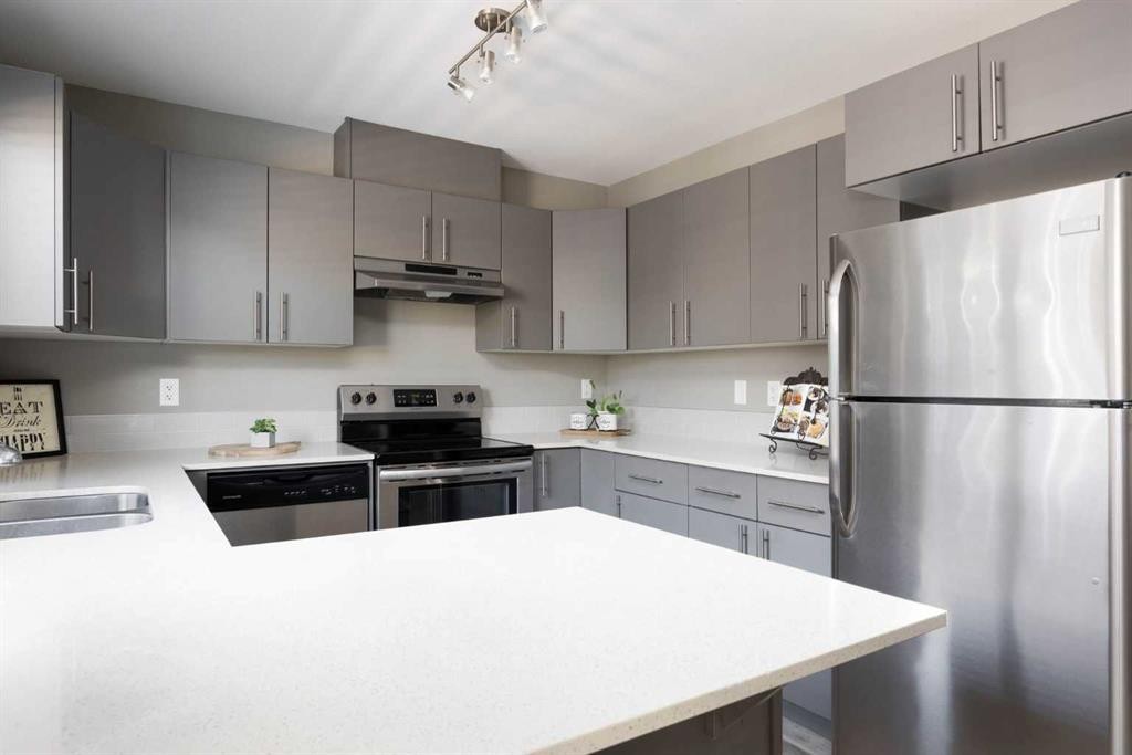 57-401 Athabasca Avenue, Fort Mcmurray, AB - Indoor Photo Showing Kitchen With Stainless Steel Kitchen With Double Sink With Upgraded Kitchen