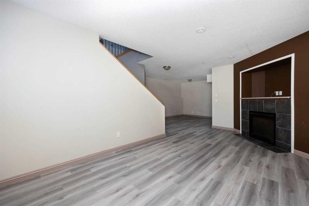 153 Leitner Gate, Fort Mcmurray, AB - Indoor Photo Showing Other Room With Fireplace