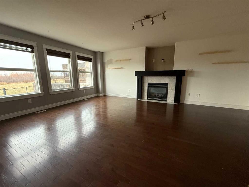 209 Walnut Crescent, Fort Mcmurray, AB - Indoor Photo Showing Living Room With Fireplace