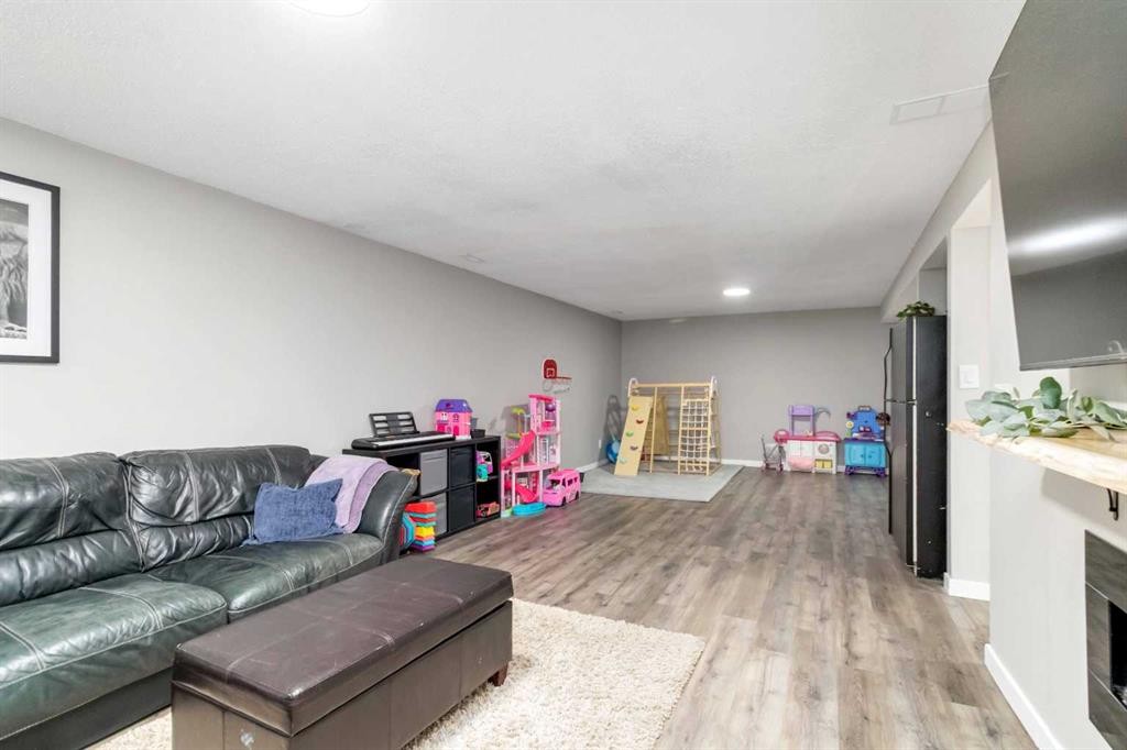 247 Cornwall Drive, Fort Mcmurray, AB - Indoor Photo Showing Living Room With Fireplace