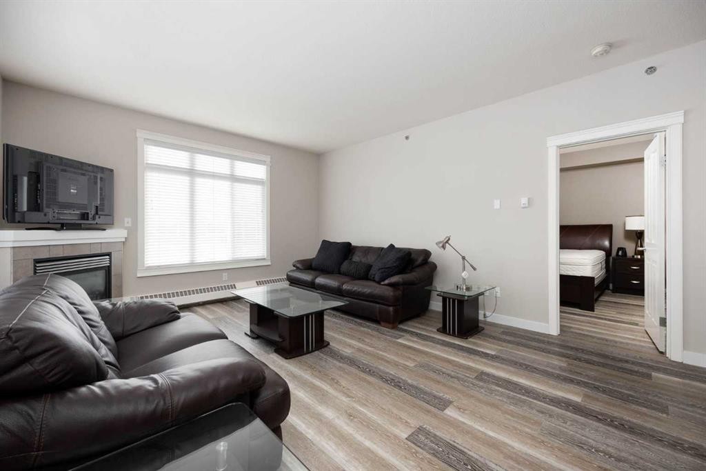 407-100 Denholm Gate, Fort Mcmurray, AB - Indoor Photo Showing Living Room With Fireplace
