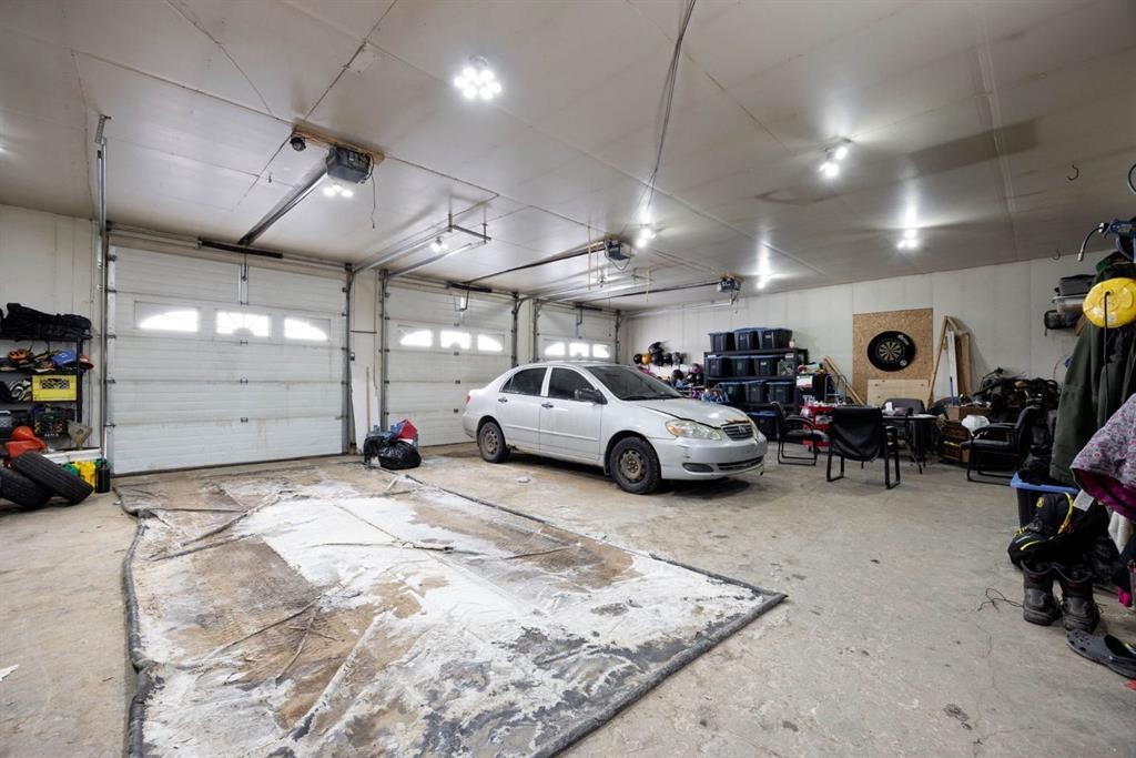 100 Christina Drive, Anzac, AB - Indoor Photo Showing Garage