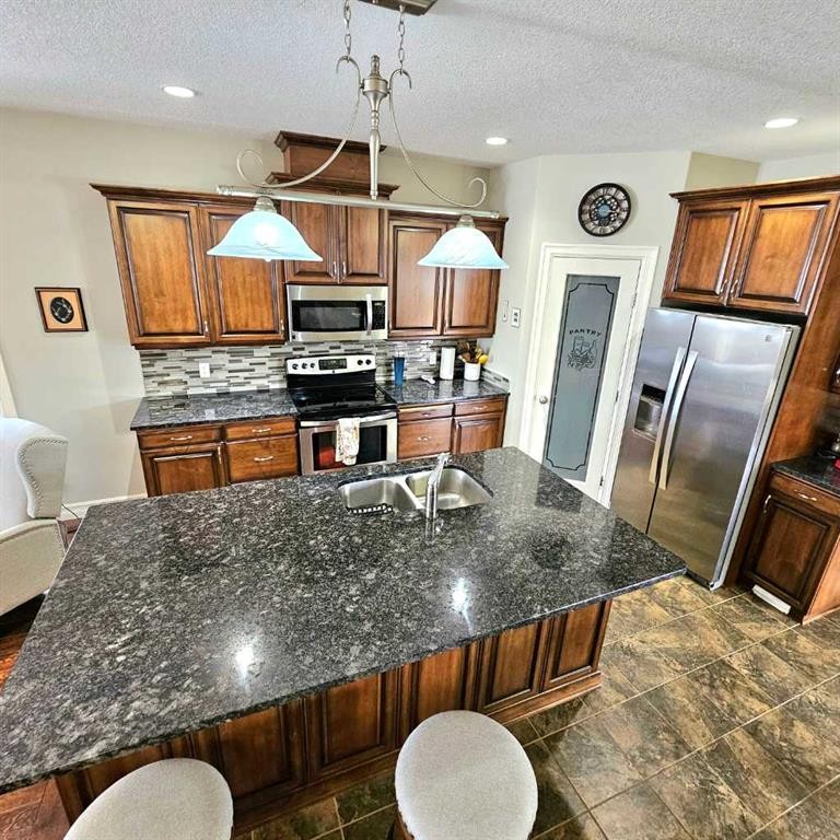 307 Highland Way, Lac La Biche, AB - Indoor Photo Showing Kitchen With Double Sink