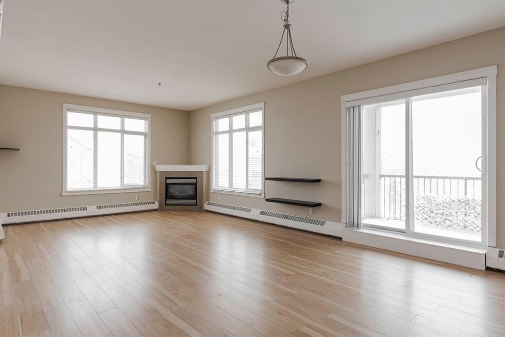 204-100 Denholm Gate, Fort Mcmurray, AB - Indoor Photo Showing Living Room With Fireplace