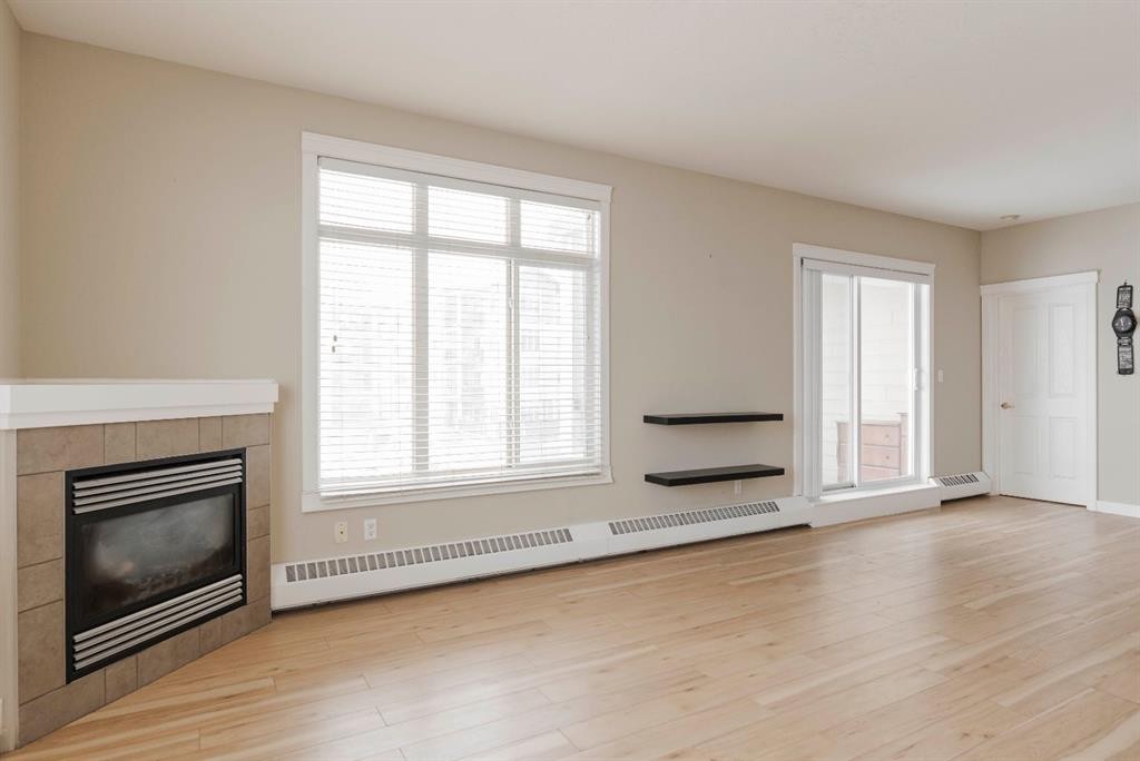 204-100 Denholm Gate, Fort Mcmurray, AB - Indoor Photo Showing Living Room With Fireplace