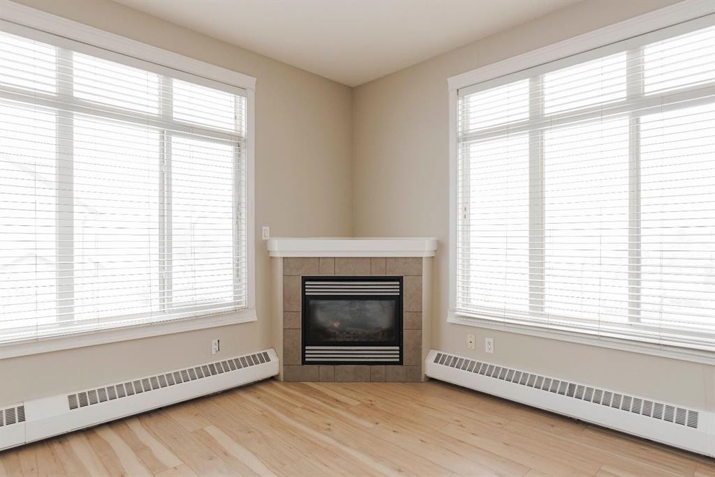 204-100 Denholm Gate, Fort Mcmurray, AB - Indoor Photo Showing Living Room With Fireplace