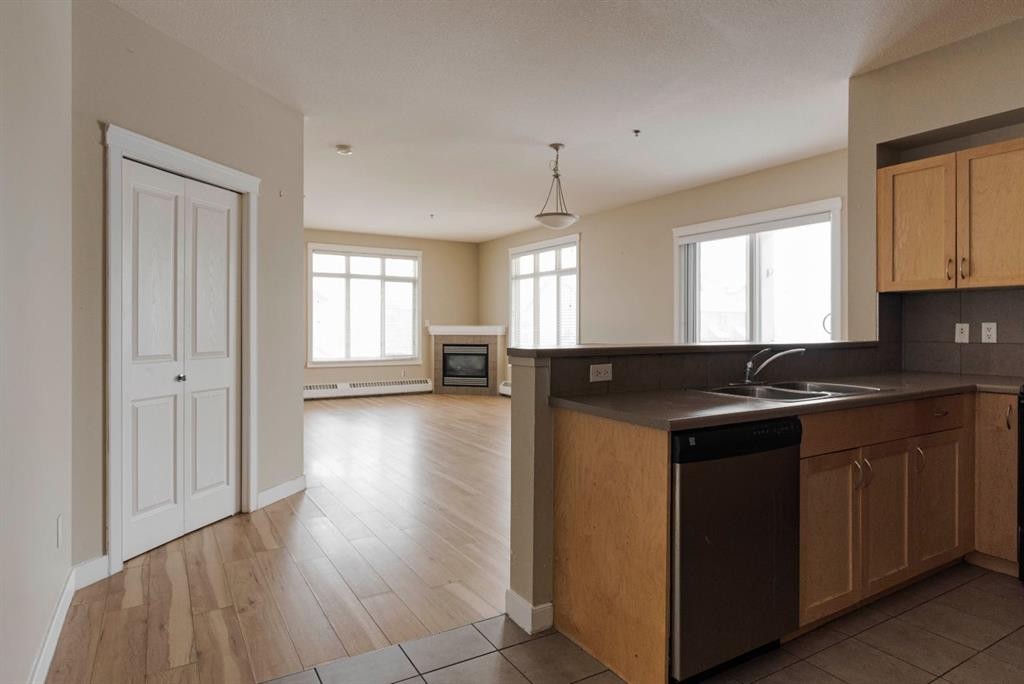 204-100 Denholm Gate, Fort Mcmurray, AB - Indoor Photo Showing Kitchen With Double Sink