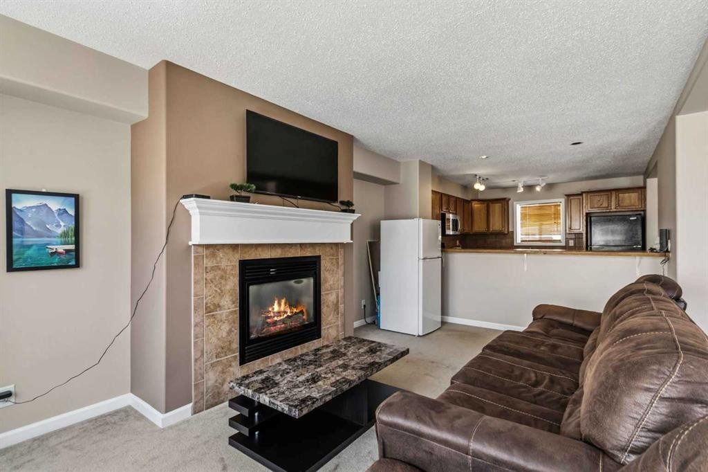 93-313 Millennium Drive, Fort Mcmurray, AB - Indoor Photo Showing Living Room With Fireplace