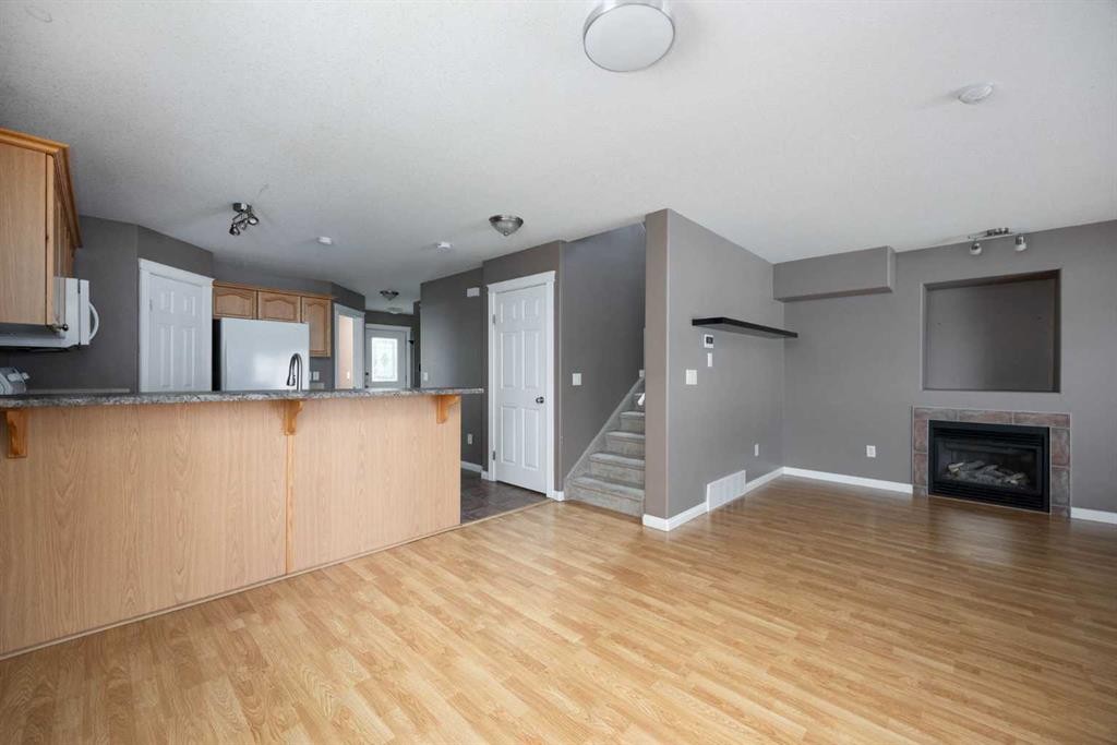 148 Fox Crescent, Fort Mcmurray, AB - Indoor Photo Showing Kitchen With Fireplace