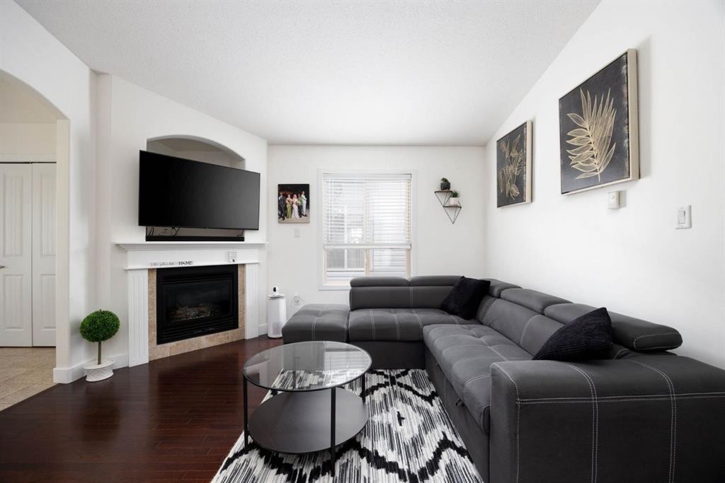 128 Hawthorn Way, Fort Mcmurray, AB - Indoor Photo Showing Living Room With Fireplace