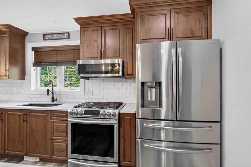 102 Gregoire Drive, Anzac, AB - Indoor Photo Showing Kitchen With Stainless Steel Kitchen