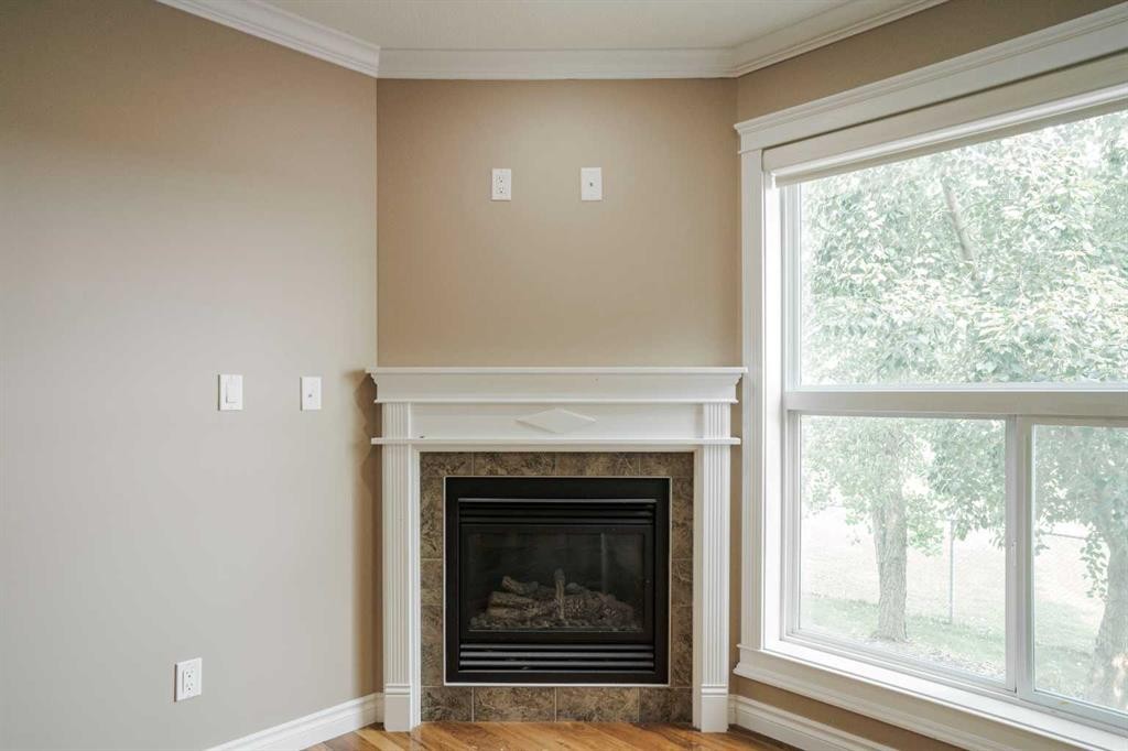 18-193 O'Coffey Crescent, Fort Mcmurray, AB - Indoor Photo Showing Other Room With Fireplace