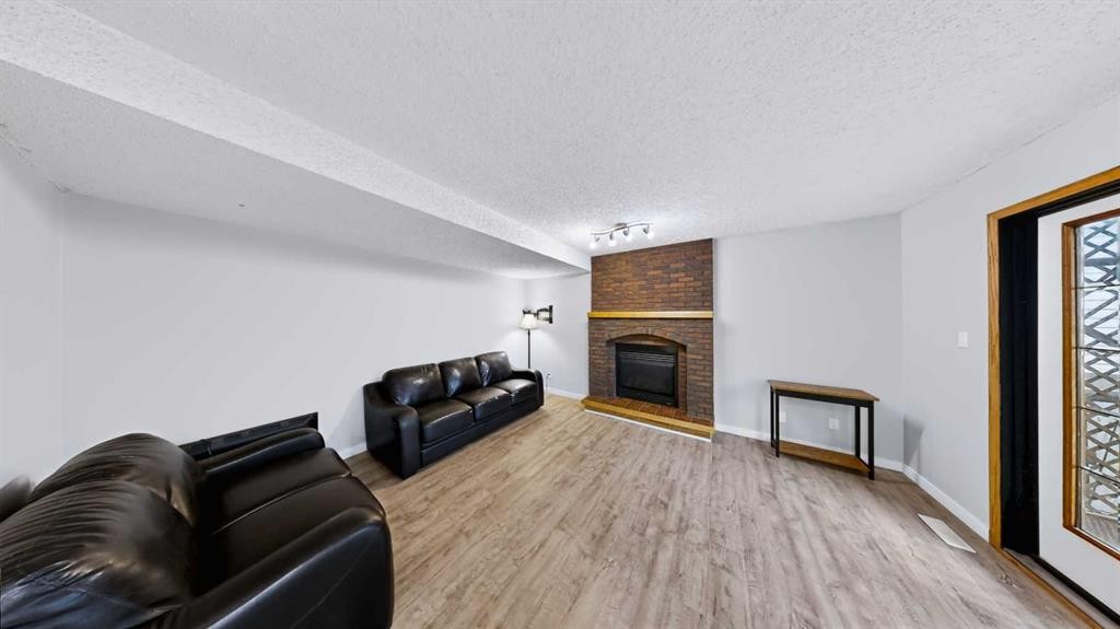245 Bacon Place, Fort Mcmurray, AB - Indoor Photo Showing Living Room With Fireplace