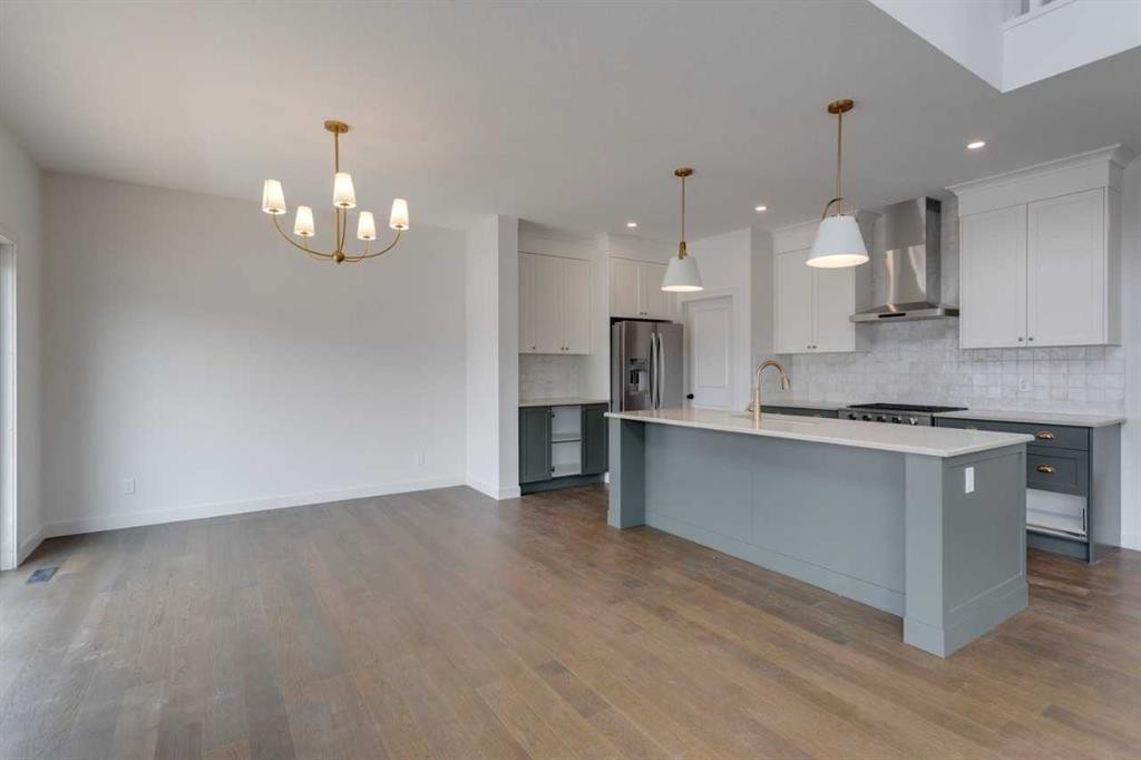 21 Bayview Mews Sw, Airdrie, AB - Indoor Photo Showing Kitchen With Stainless Steel Kitchen With Upgraded Kitchen