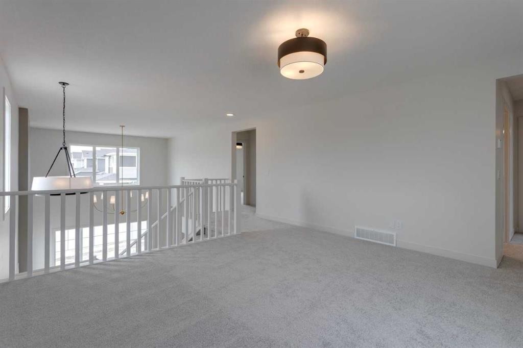 21 Bayview Mews Sw, Airdrie, AB - Indoor Photo Showing Other Room