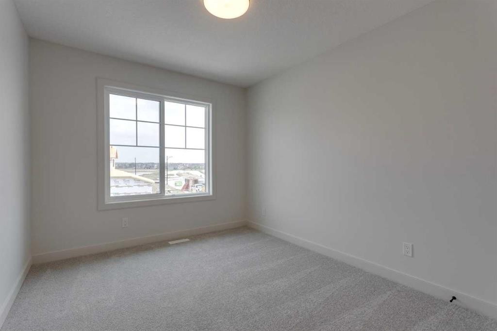 21 Bayview Mews Sw, Airdrie, AB - Indoor Photo Showing Other Room