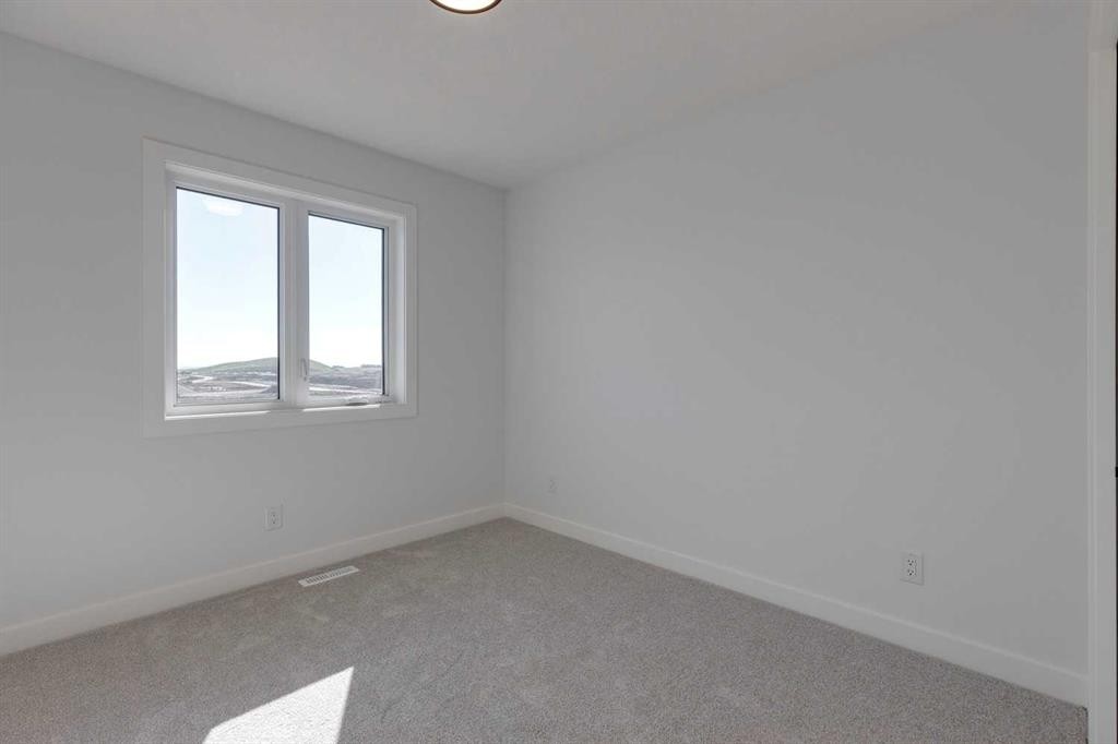 95 Southborough Crescent, Cochrane, AB - Indoor Photo Showing Other Room