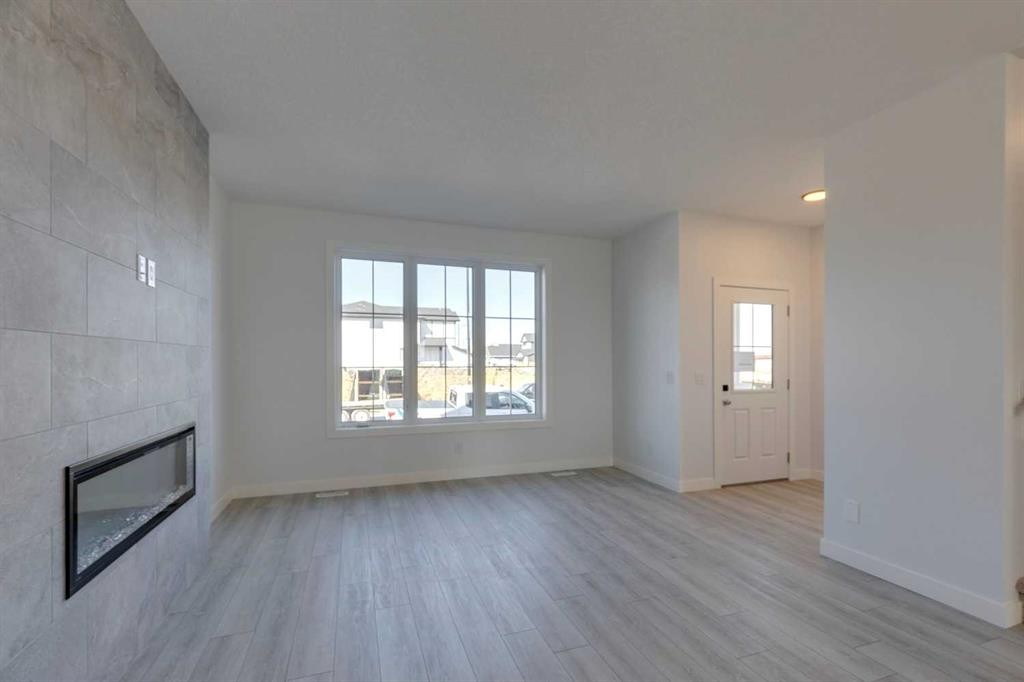 95 Southborough Crescent, Cochrane, AB - Indoor With Fireplace