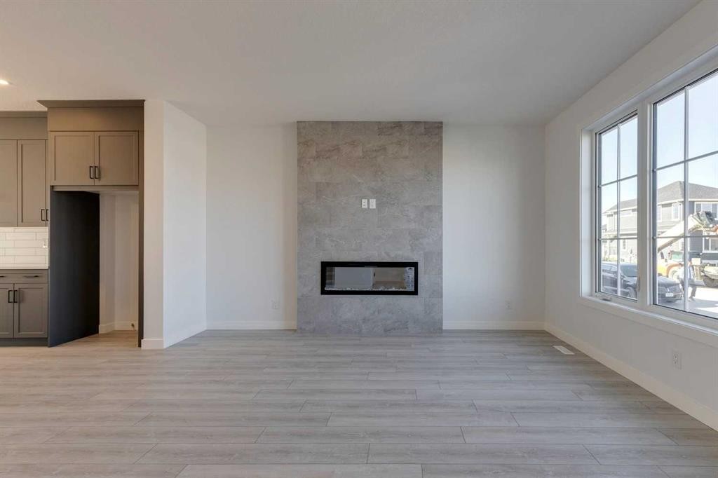 95 Southborough Crescent, Cochrane, AB - Indoor Photo Showing Living Room With Fireplace