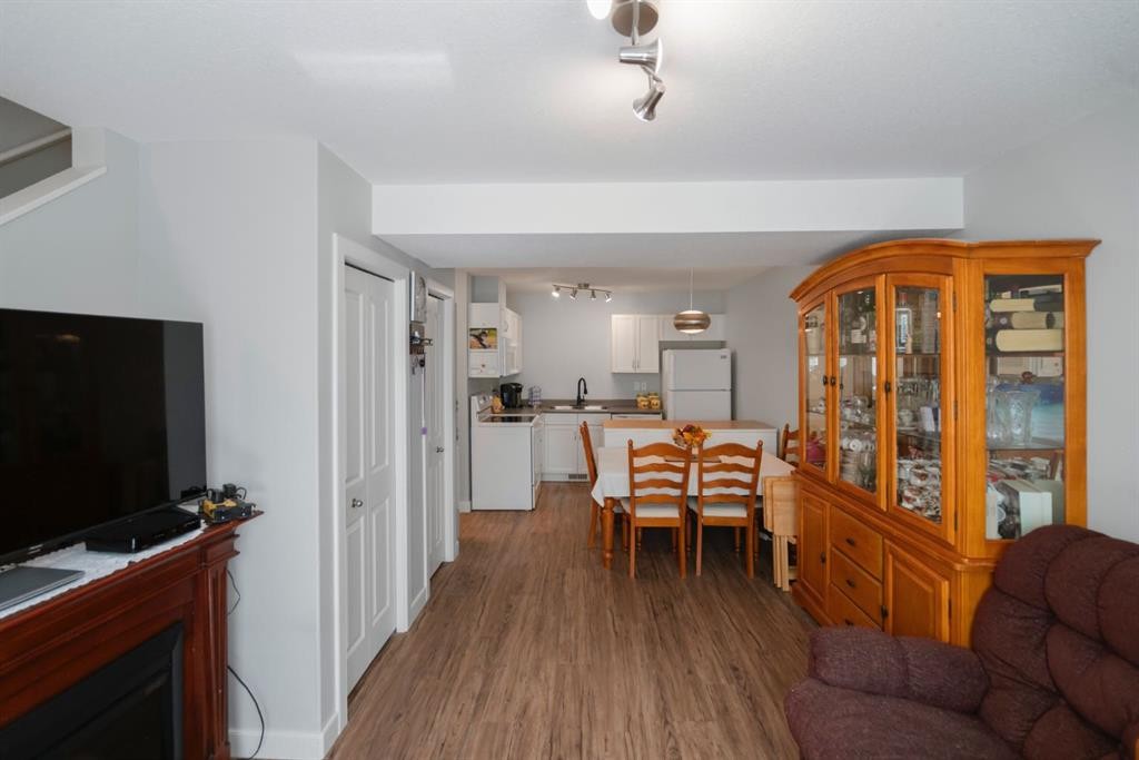 G-5220 41 Street, Camrose, AB - Indoor With Fireplace