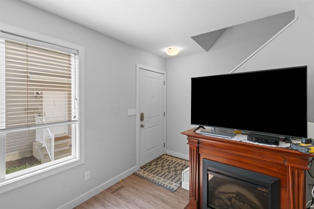 G-5220 41 Street, Camrose, AB - Indoor With Fireplace