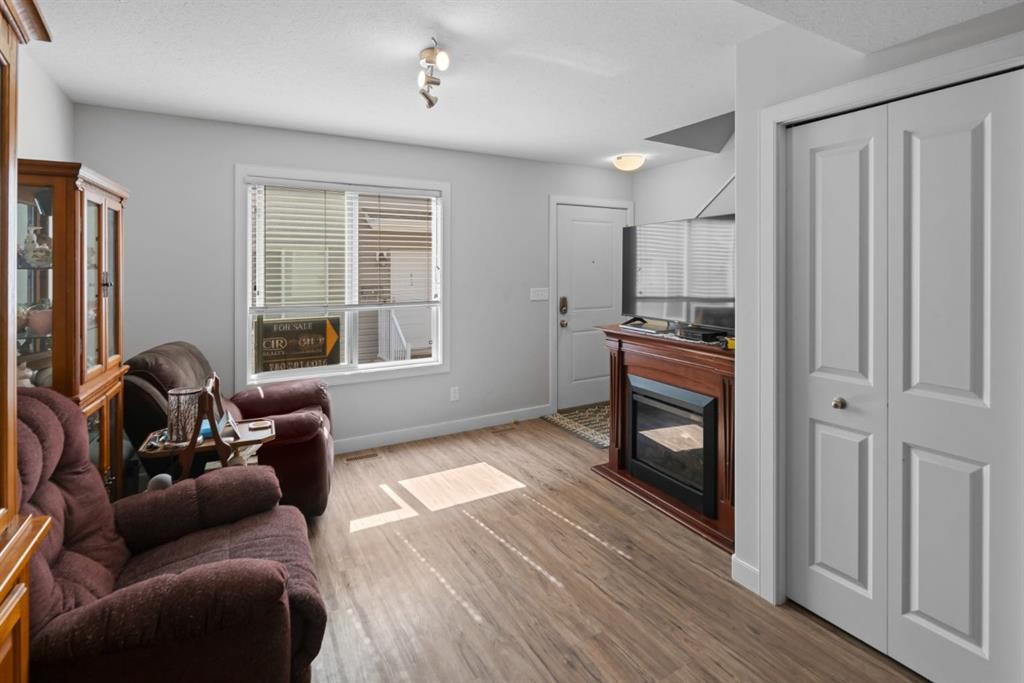 G-5220 41 Street, Camrose, AB - Indoor Photo Showing Other Room With Fireplace